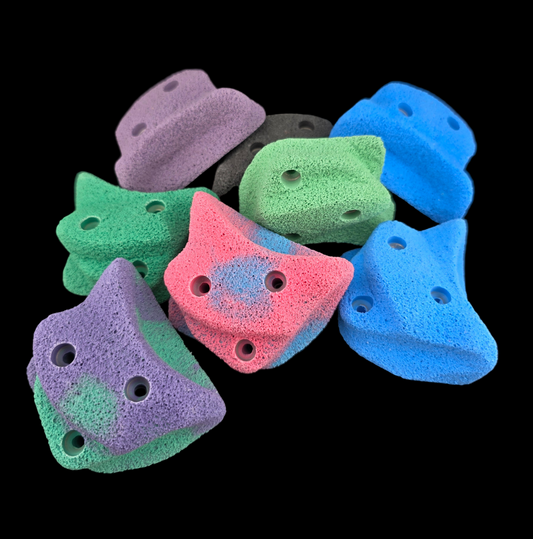 Pile of different colored Blob Screw-on climbing holds