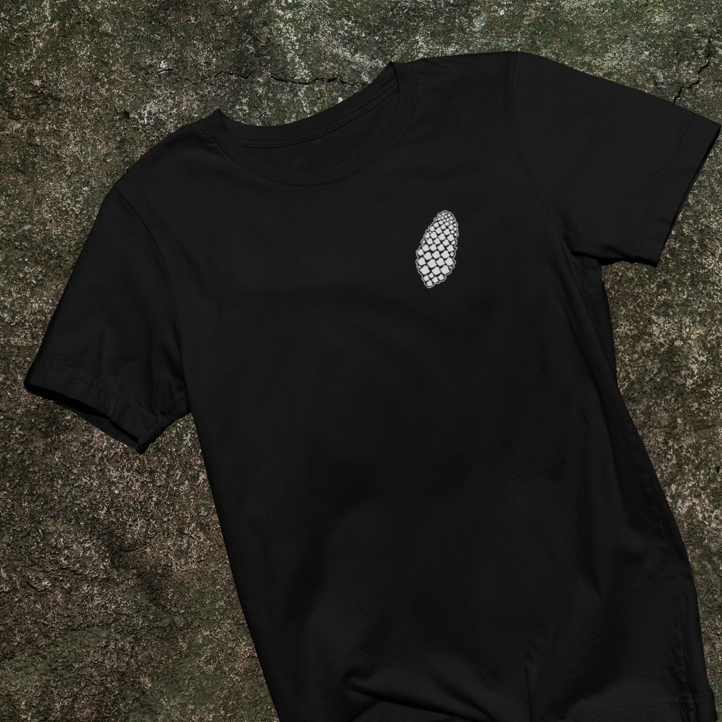 Pinecone black T-Shirt on rock