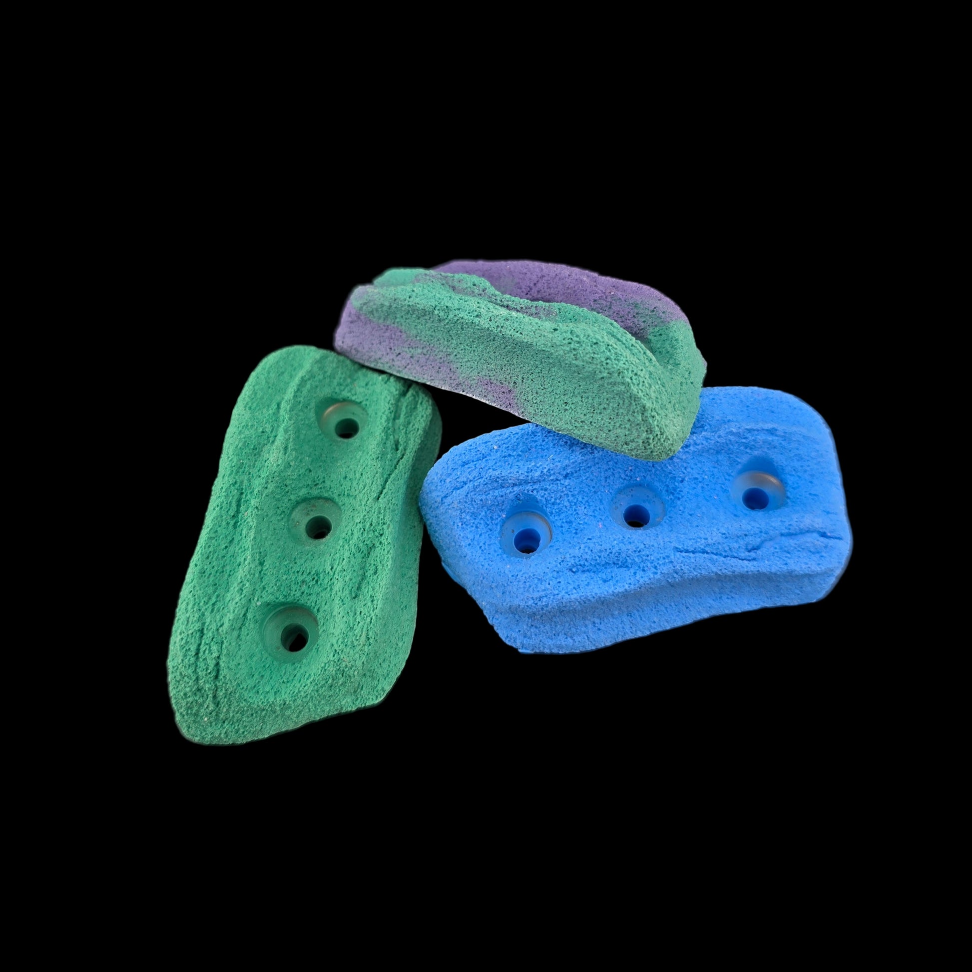 Pile of different colored crimp shaped climbing holds
