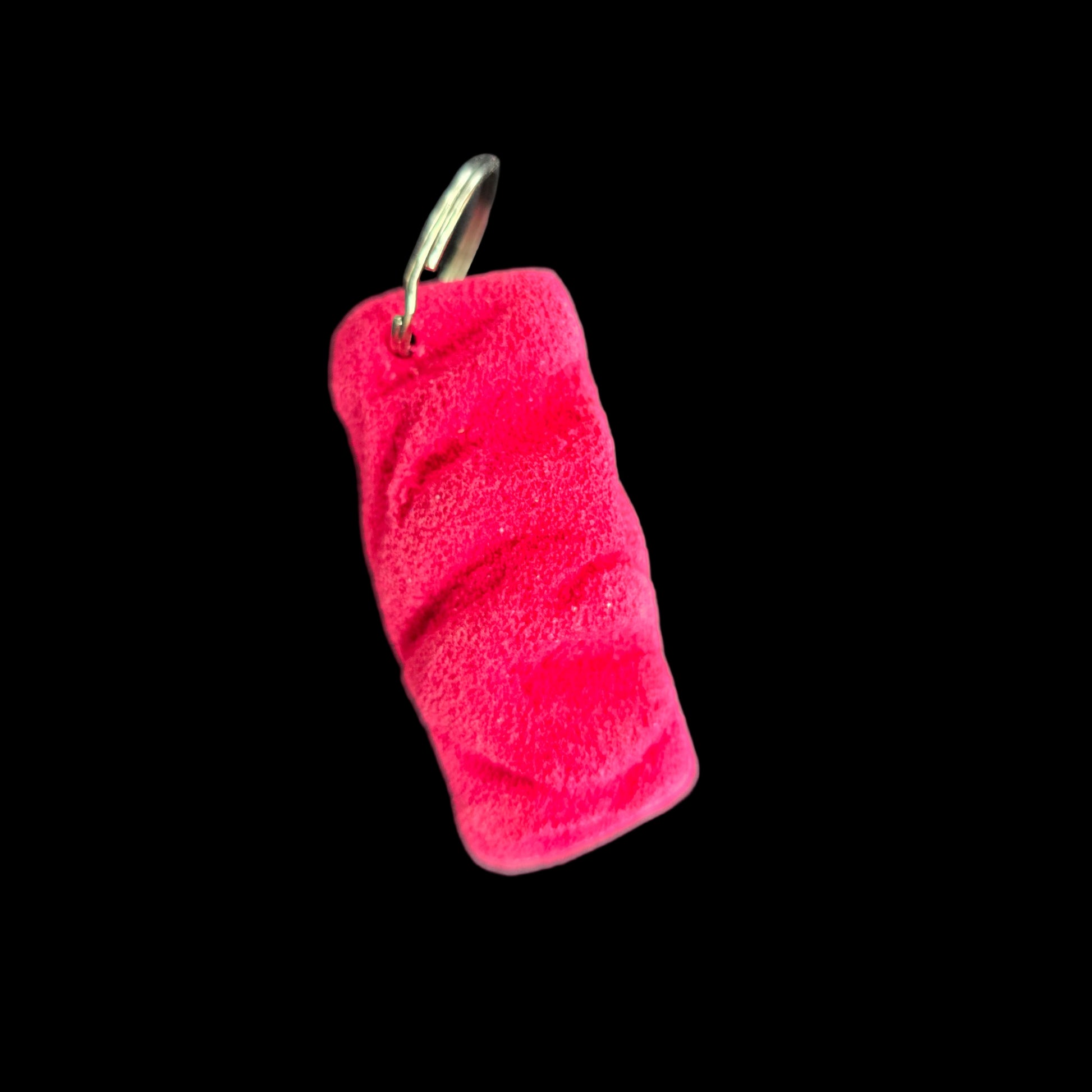 Pink colored eroded shape climbing hold keychain