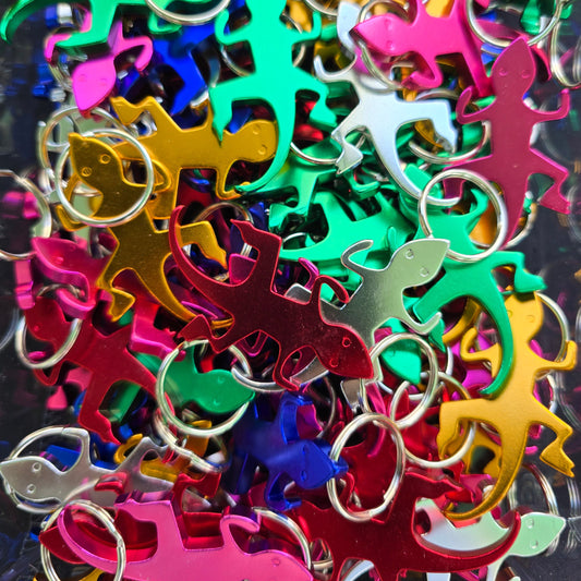 Multiple different colored gecko bottle opener keychains