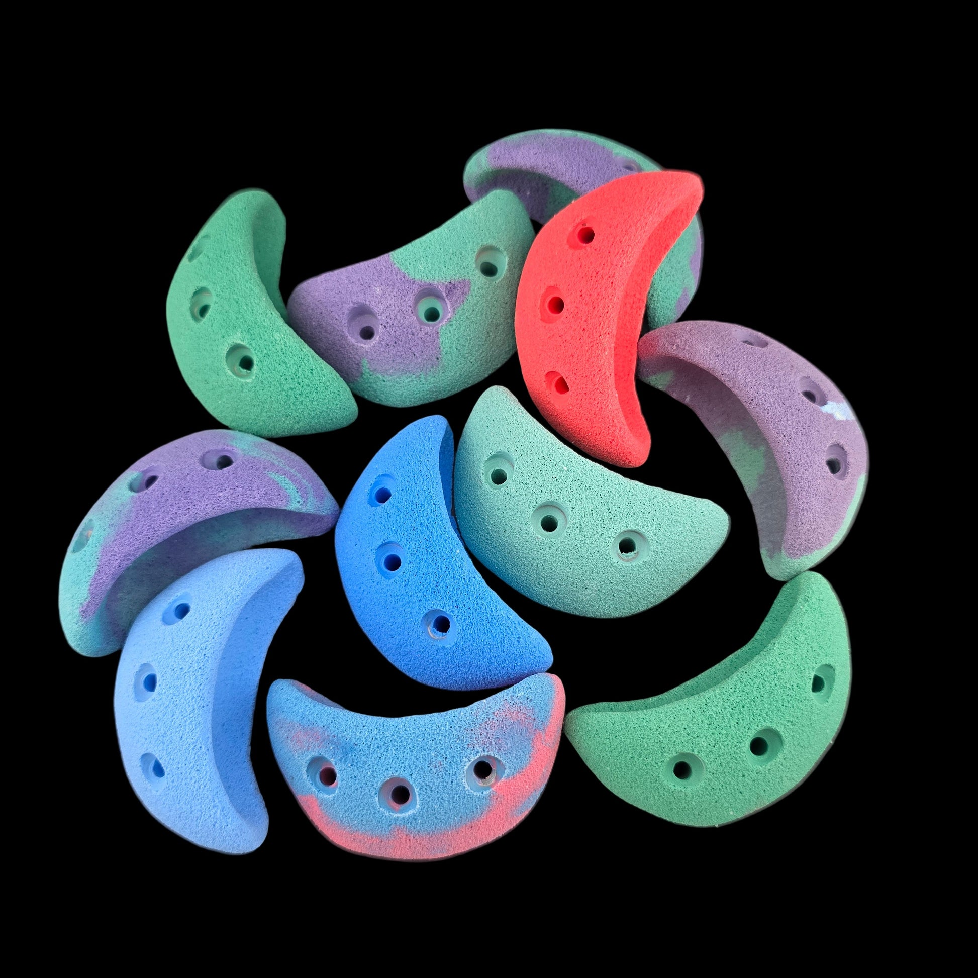 Pile of different colored jug shaped screw-on climbing holds