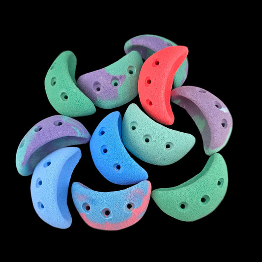 Pile of different colored jug shaped screw-on climbing holds
