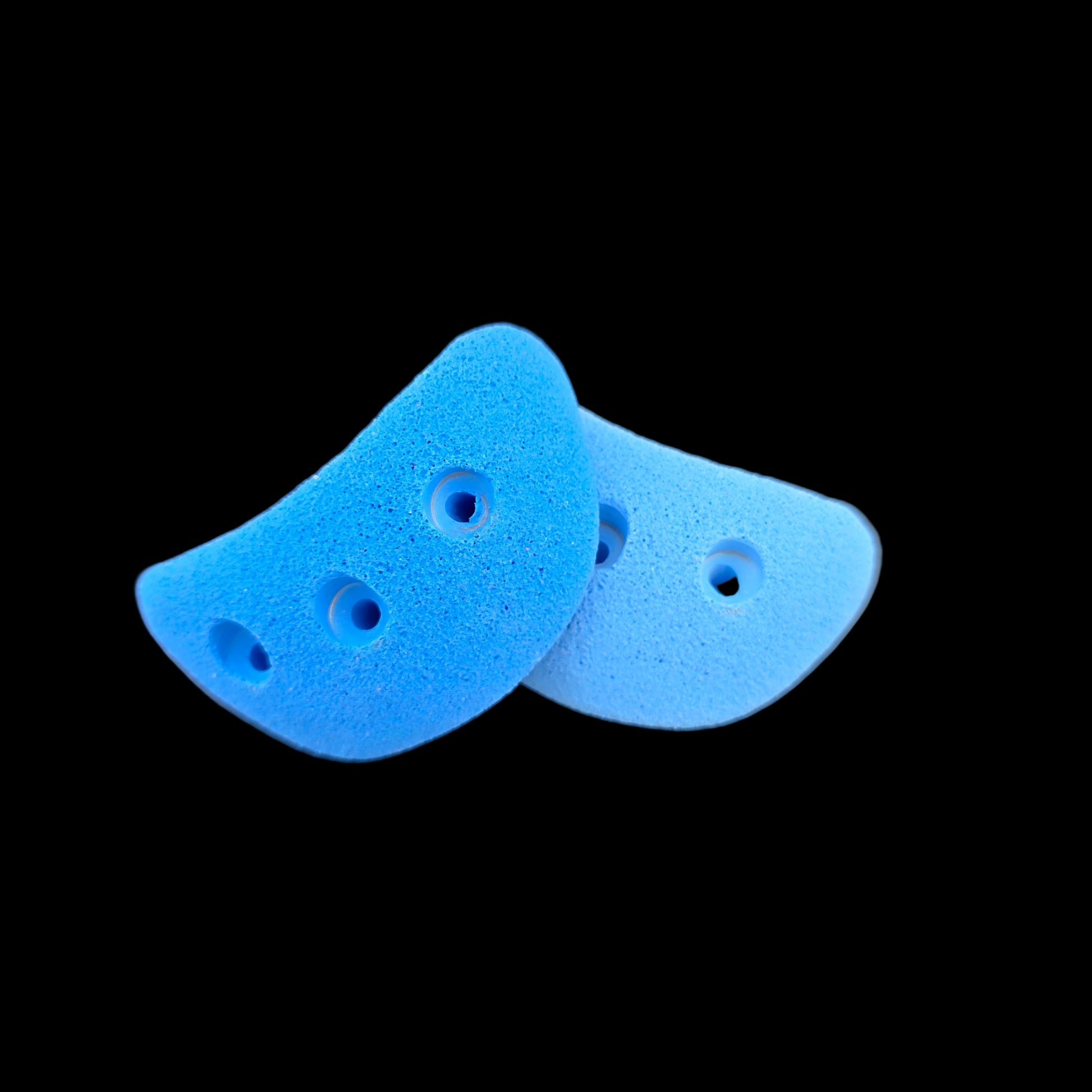 Multiple blue colored jug shaped screw-on climbing holds