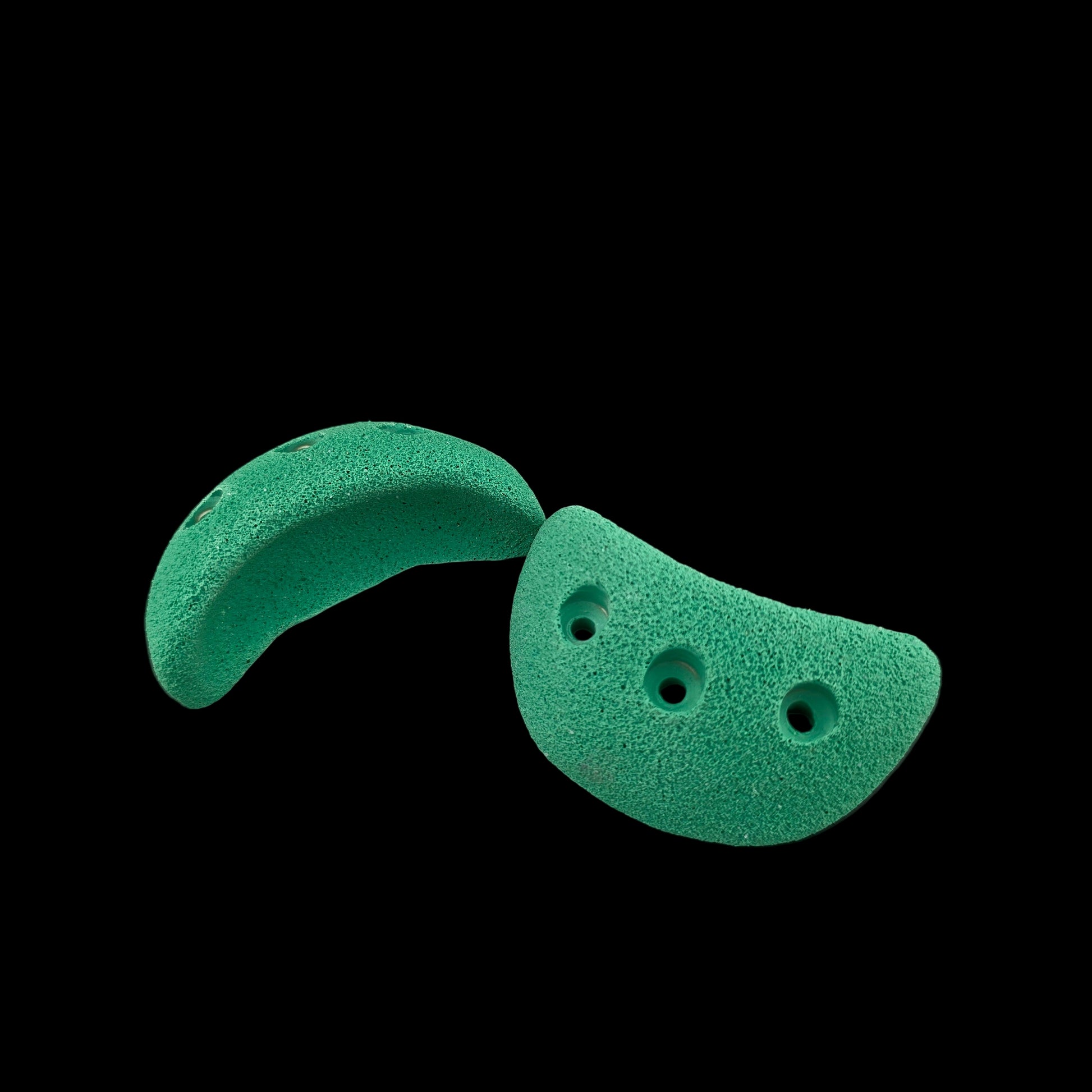 Multiple green colored jug shaped screw-on climbing holds