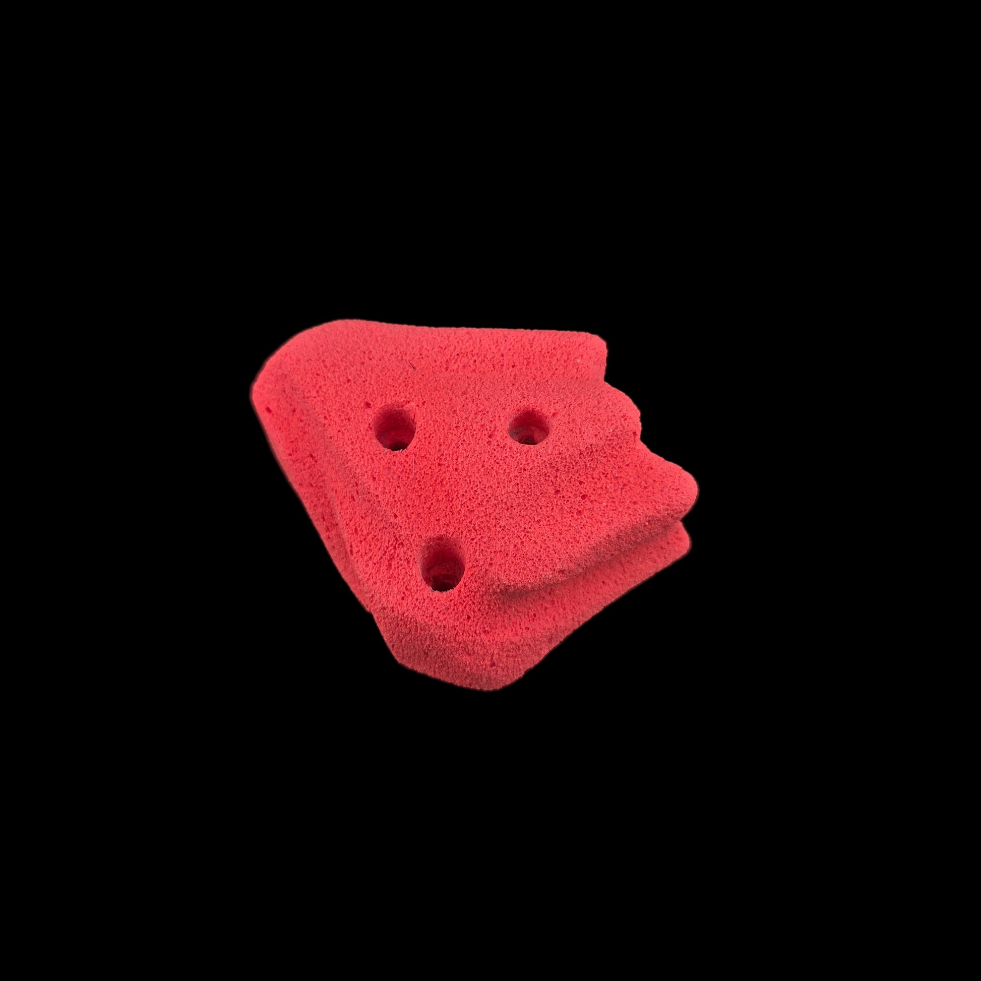 Red colored corner-less jug shaped climbing hold