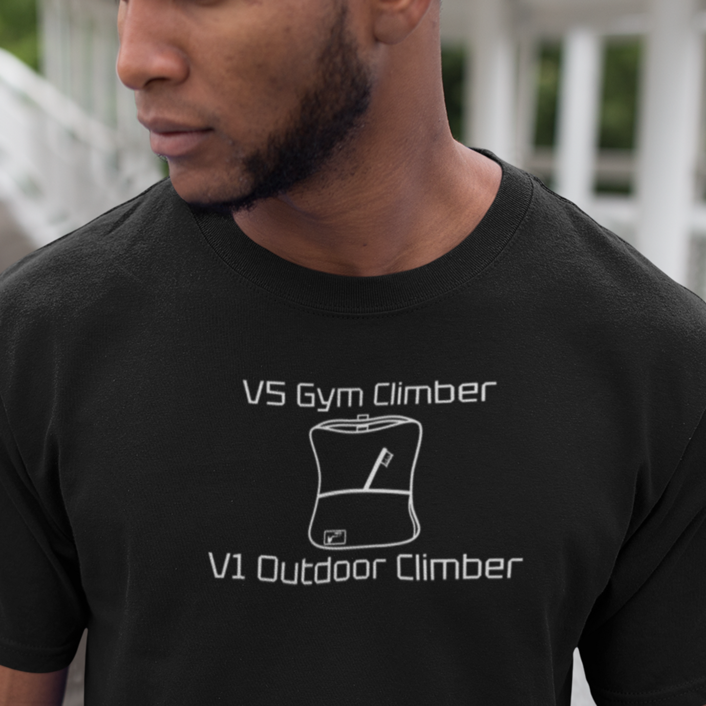 Man wearing black shirt with white V5 Gym Climber graphic