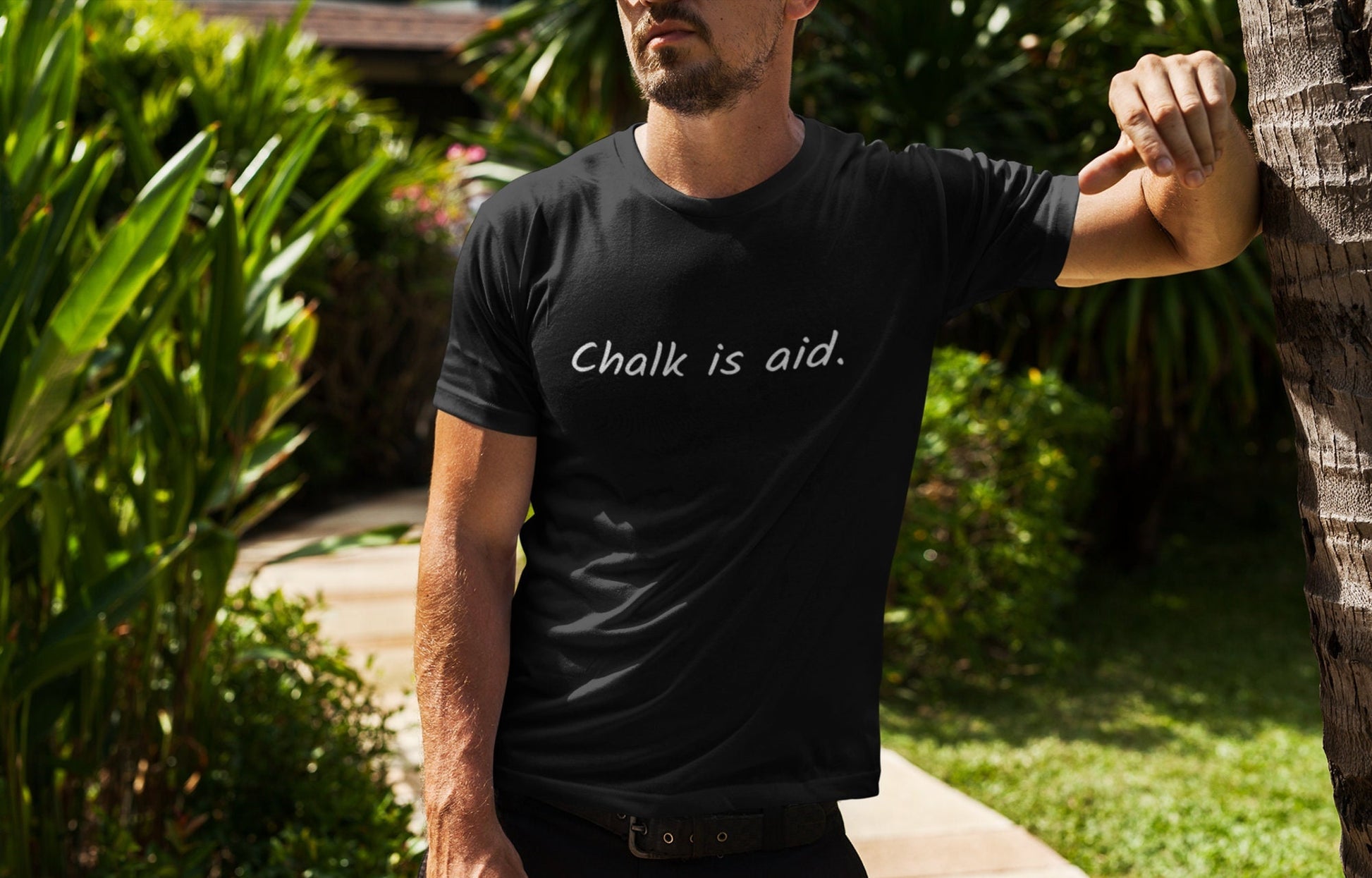 Man wearing a black Chalk is Aid climbing t-shirt