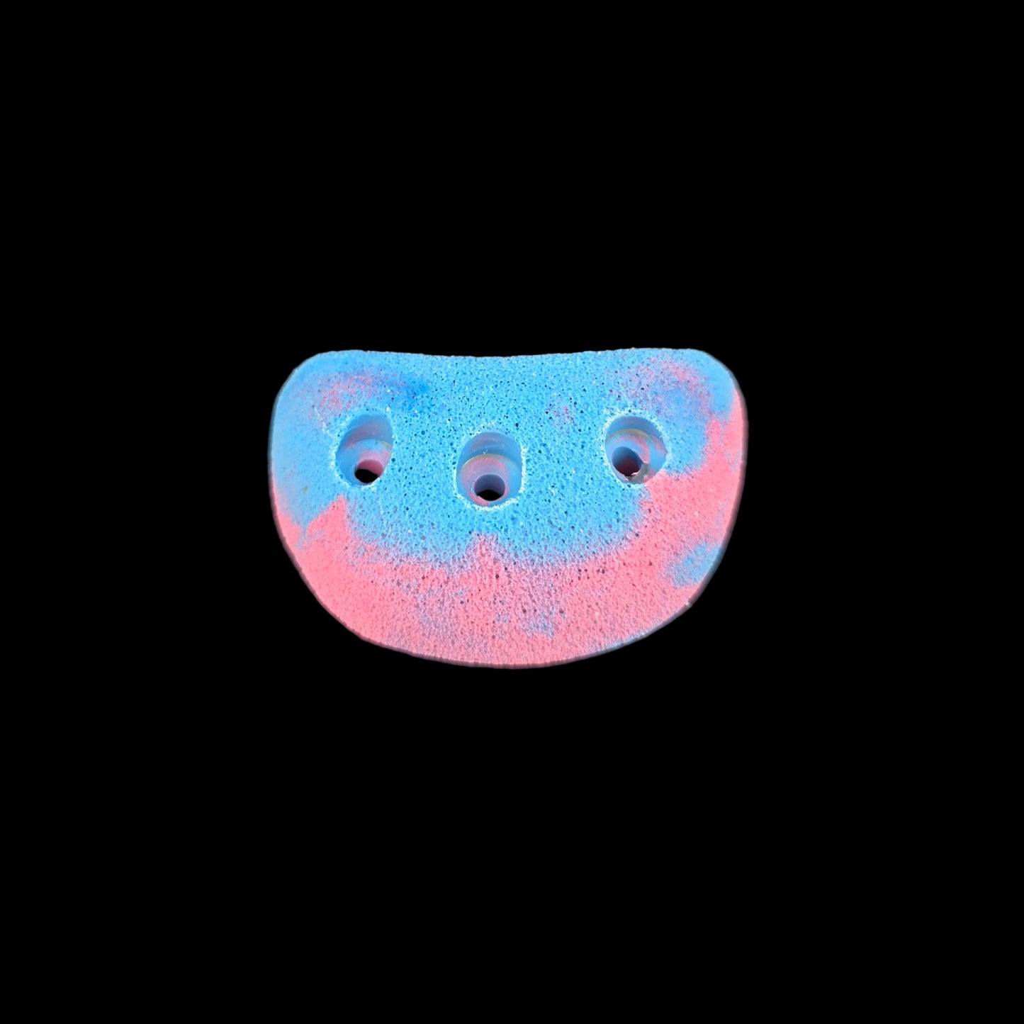 Pink and blue colored jug shaped screw-on climbing hold